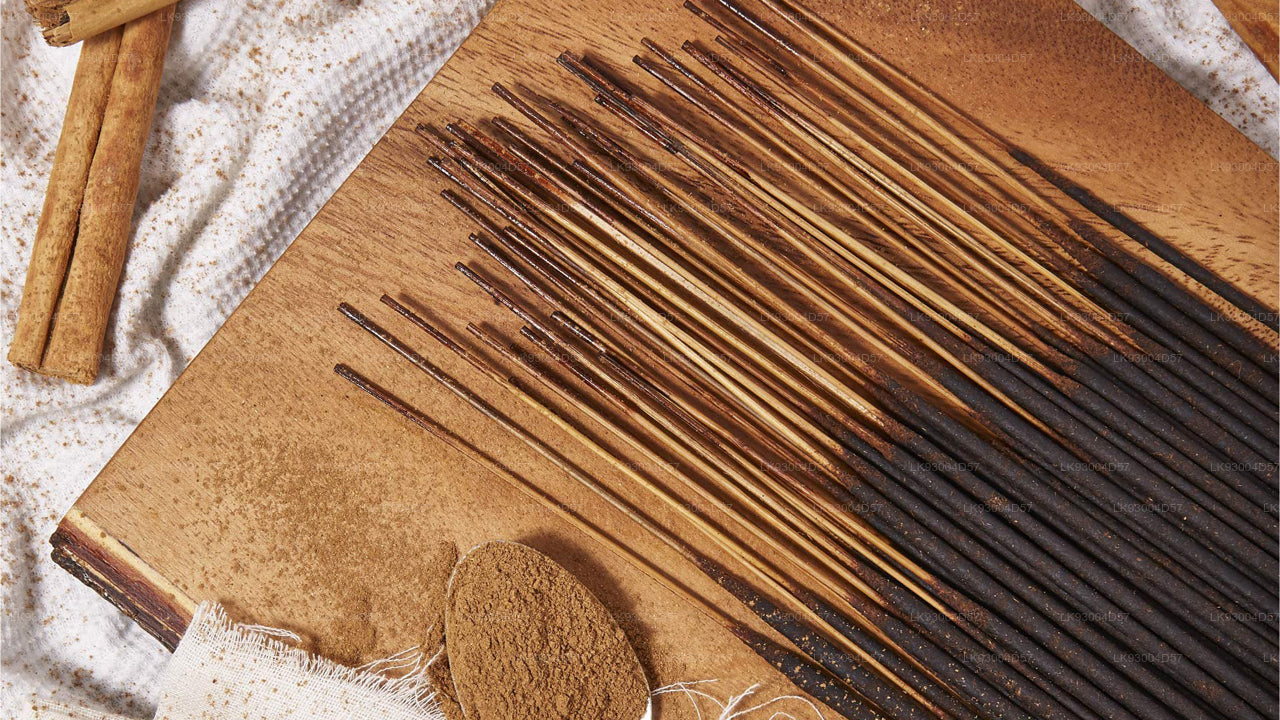 Cinnamon incense stick holder with incense sticks on a textured surface